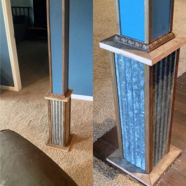 Decorative basement pole with tin sheet metal and wooden trim accents.