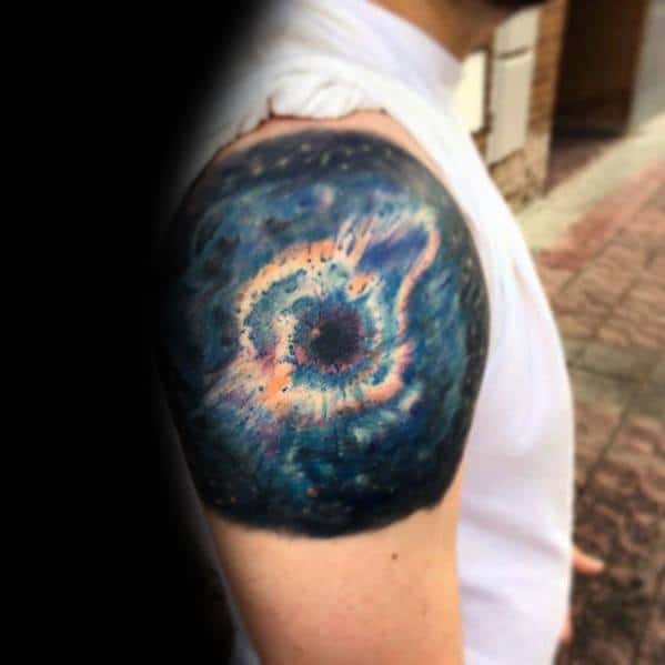 Colorful nebula tattoo on upper arm, paired with a white sleeveless shirt