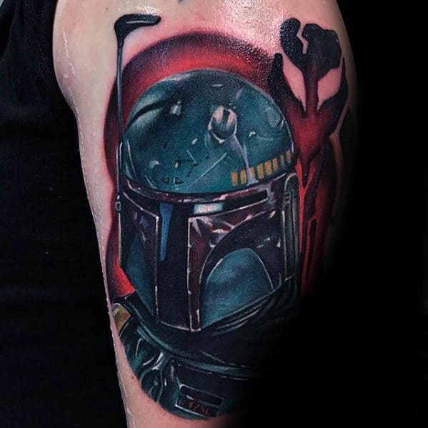 Realistic Boba Fett tattoo with deep green tones, red highlights, and the Mythosaur skull symbol in the background on the upper arm.