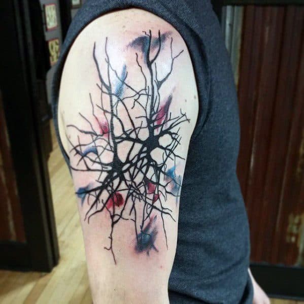 Abstract neuron tattoo on upper arm with bold black branching lines and watercolor-style splashes of red, blue, and purple.