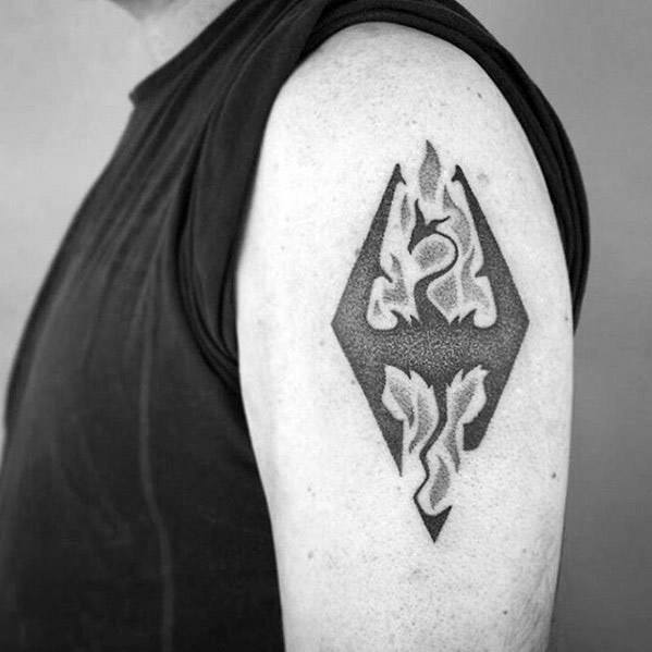 A Skyrim flame tattoo design on a person's upper arm