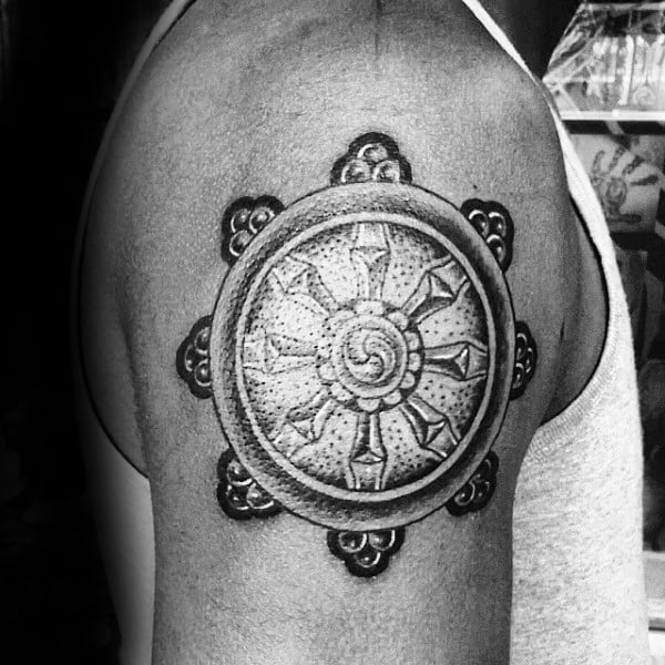 Upper Arm Male Dharma Wheel Tattoo