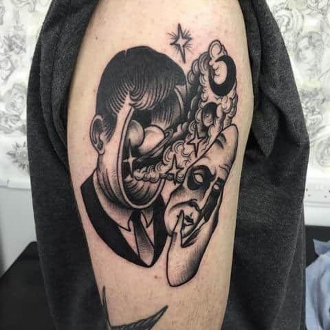 Surreal blackwork tattoo of a man pulling off a mask, revealing swirling cosmic elements and abstract facial distortion.