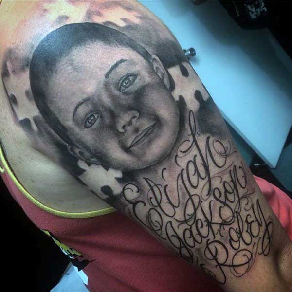 Upper Arm Puzzle Piece Potrait Tattoo On Man