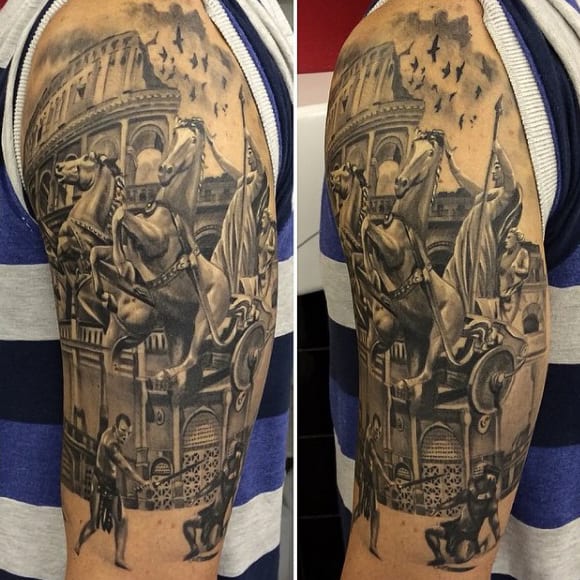 Detailed arm tattoo with a Roman scene including a gladiator, chariot, horses, and the Colosseum