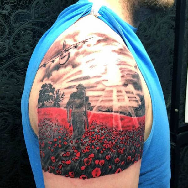 Upper Arm Solider Walking In Poppy Field Mens Tattoo