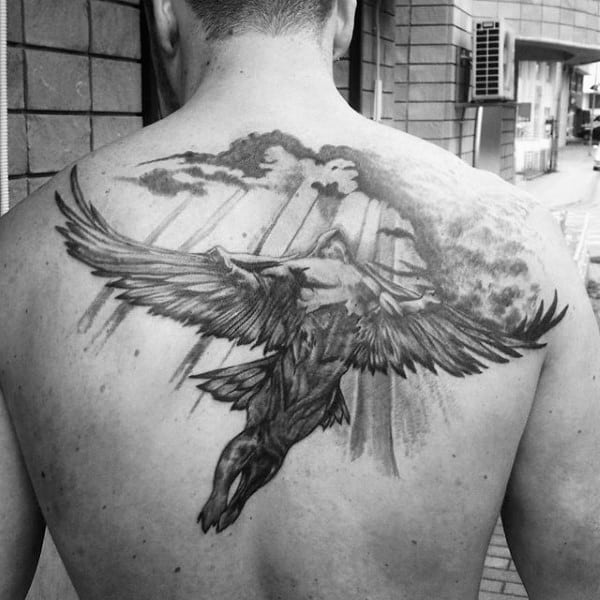Upper Back Icarus Sunrays And Clouds Tattoo Design On Man