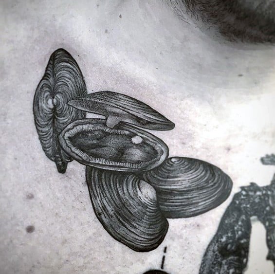 Realistic black and grey tattoo of a cluster of clams, with one open shell revealing a small pearl inside, detailed with fine line texture.