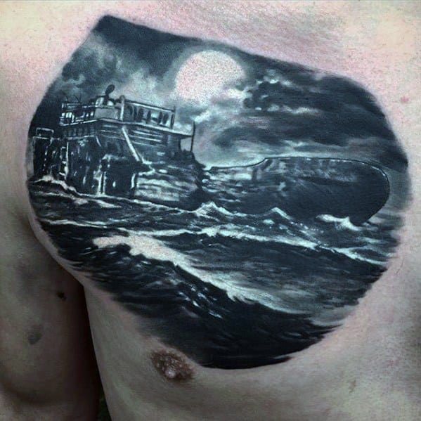 Black and grey chest tattoo of a wrecked ship on rocky shores under a full moon, with crashing waves and dramatic night sky lighting.