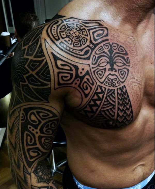 Upper Chest And Half Sleeve Tribal Tattoos For Guys