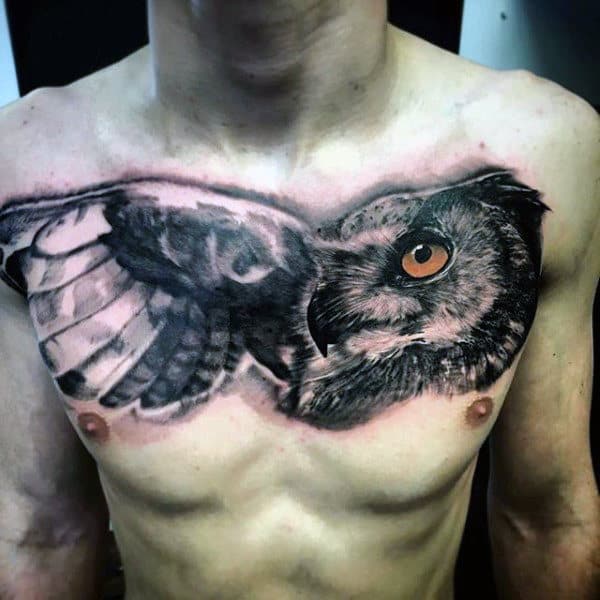 Upper Chest Black Ink Shaded Owl Tattoo For Men With Orange Eye