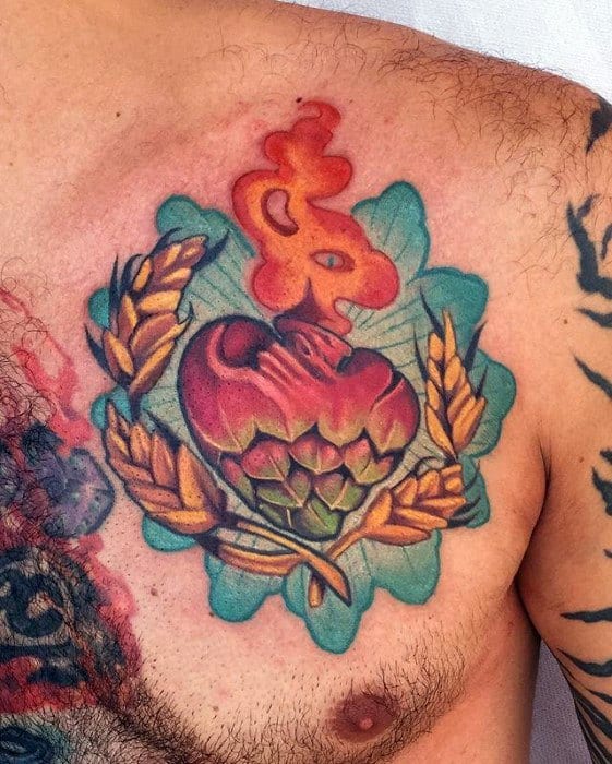 Colorful chest tattoo featuring a sacred heart transformed into a hop cone, surrounded by wheat stalks and oak leaves, symbolizing a fiery passion for craft beer.