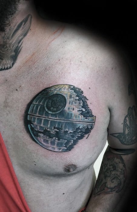 Realistic Death Star tattoo on the upper chest, showcasing its iconic design and intricate details