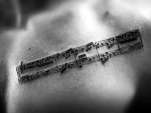 Upper Chest Music Staff Tattoo Design Ideas For Males