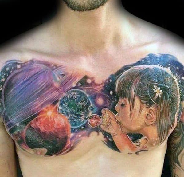 Tattoo of a young girl blowing bubbles, with planets and galaxies surrounding her, blending cosmic imagery with soft, ethereal colors for a dreamy, otherworldly design.