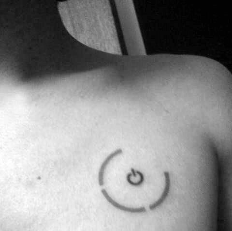 Minimalist power symbol tattoo on the chest, placed around the nipple with two curved lines forming a circular design.