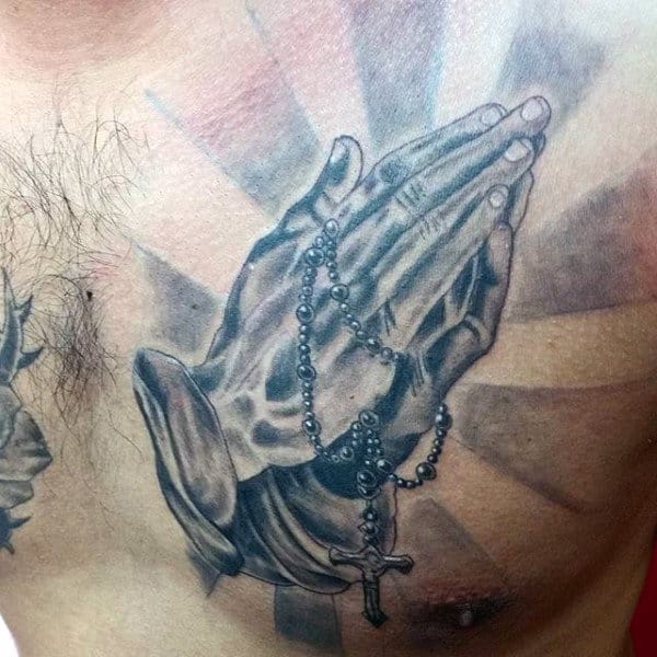 Upper Chest Sun Rays Tattoos Of Praying Hands With Rosary For Guys