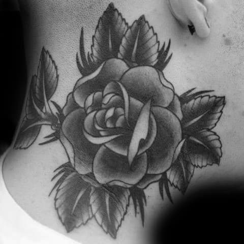 Black and gray rose tattoo with leaves on a man's neck