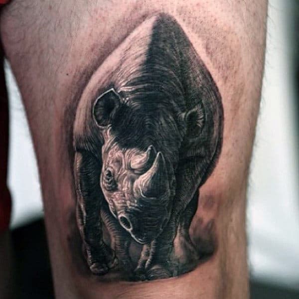 Upper Thigh Charging Realsitic Rhino Tattoo On Male