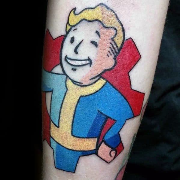Vault Boy tattoo smiling confidently in a blue and yellow jumpsuit, set against a bold red gear symbol in clean cartoon style.