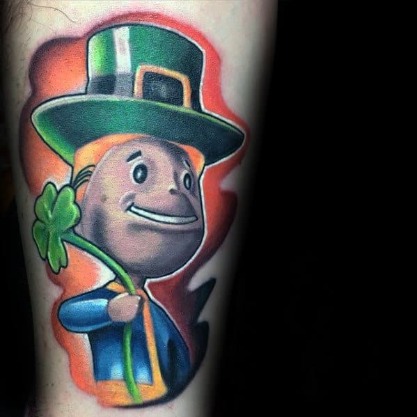 Vault Boy tattoo with a leprechaun twist, wearing a green hat and holding a shamrock, set against a glowing red and orange background.