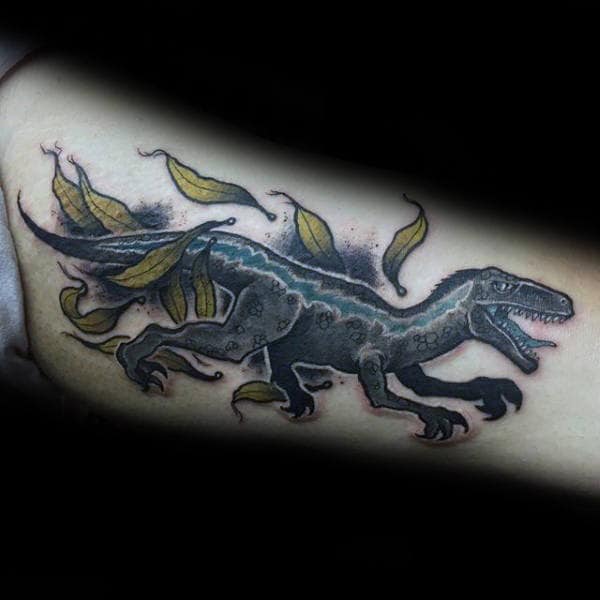 Velociraptor Moving Through Leaves Guys Inner Arm Bicep Tattoo