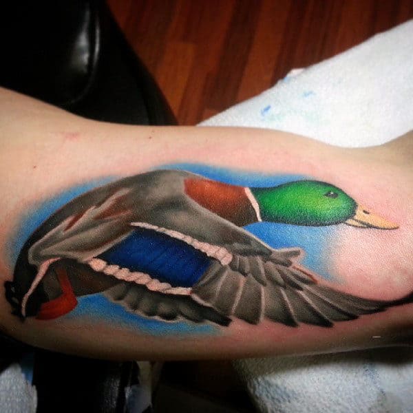 Vibrant Illustrative Mallard With Blue Sky Tattoo On Male