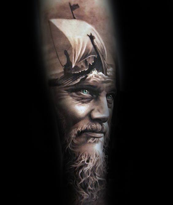 Realistic tattoo of Ragnar with a Viking ship on his head, showcasing his intense gaze and intricate beard details