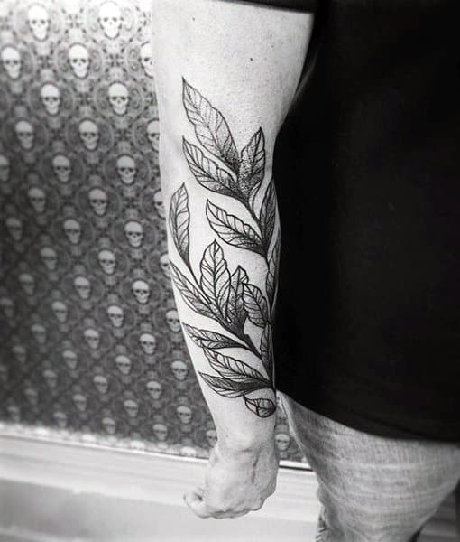 Vine Leaves Mens Tattoo On Lower Forearm
