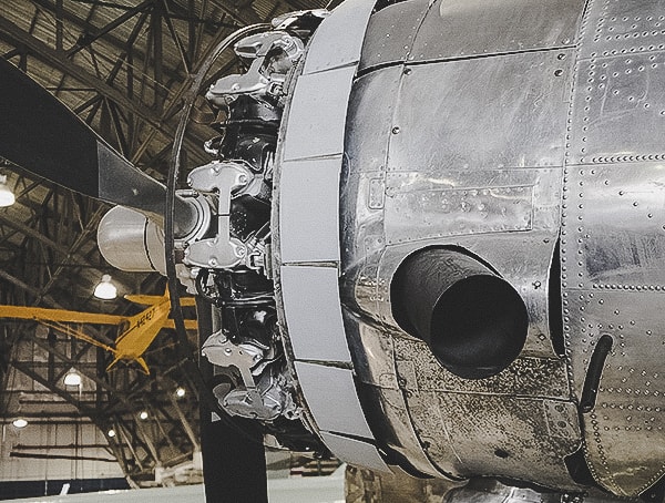 Vintage Aircraft Engine With Giant Exhuast Pipe On Side