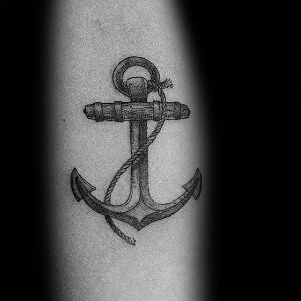 Realistic black and gray anchor tattoo with fine shading and a wrapped rope, symbolizing strength, resilience, and a deep connection to the sea.