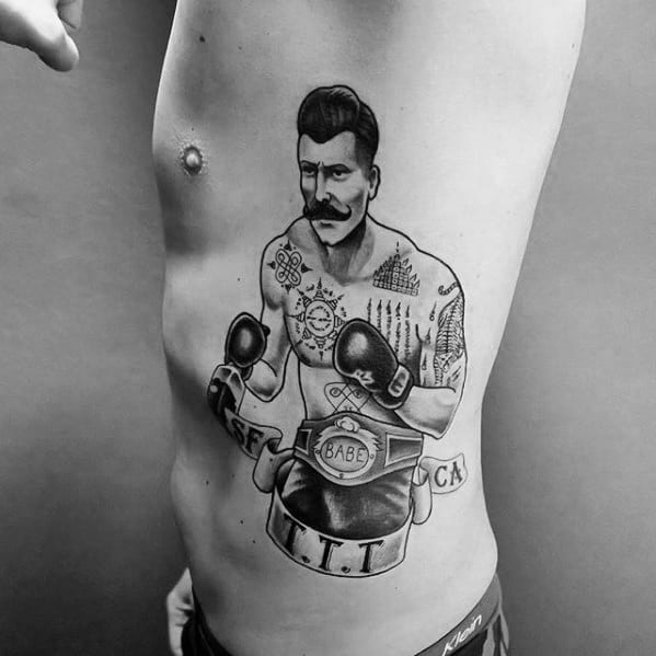 Blackwork tattoo of a vintage-style boxer with gloves, mustache, and champion belt, featuring bold outlines and classic detailing.
