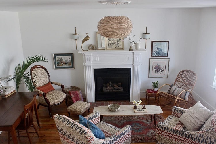 cozy vintage living room with fireplace and pattern chairs