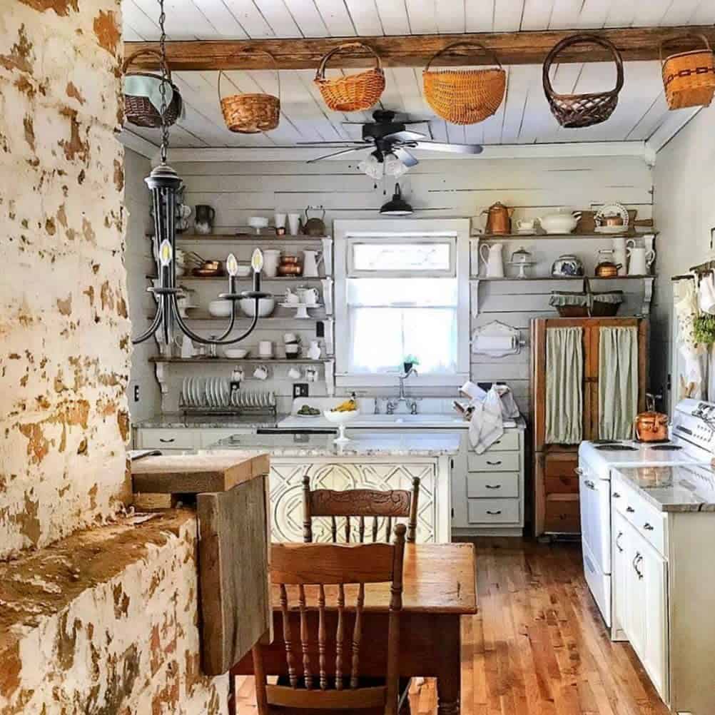 rustic farmhouse kitchen white shiplap walls with shelves hanging baskets hardwood floor