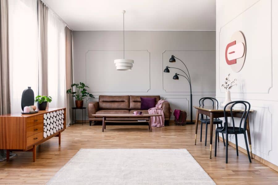 vintage mid-century living room with brown leather sofa 