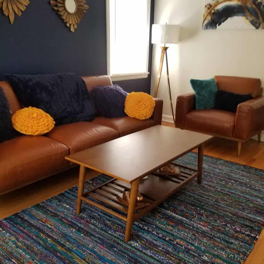 vintage brown leather sofas living room blue accent wall 