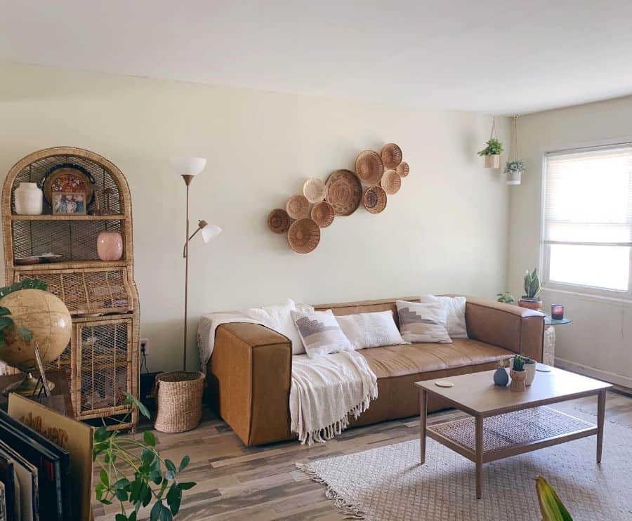 boho style living room with tan leather sofa 