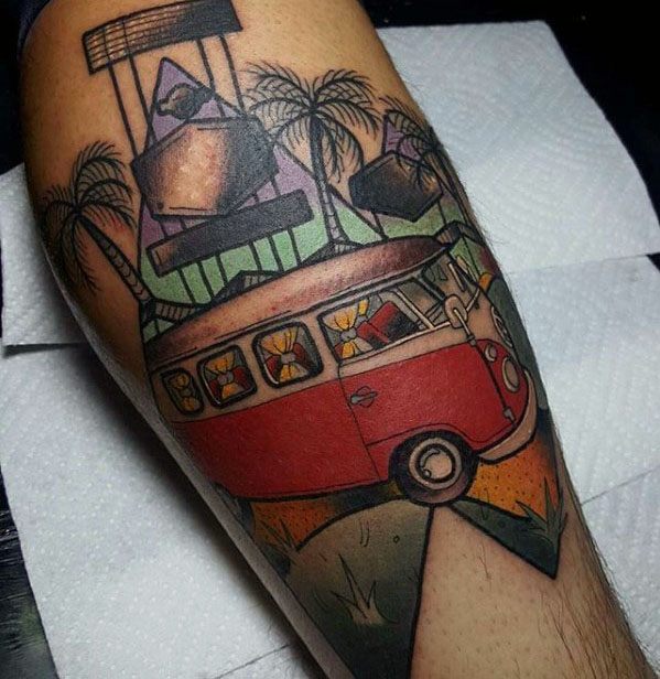 Colorful geometric-style tattoo of a red Volkswagen van driving through a sunset landscape with palm trees, signs, and abstract shapes.