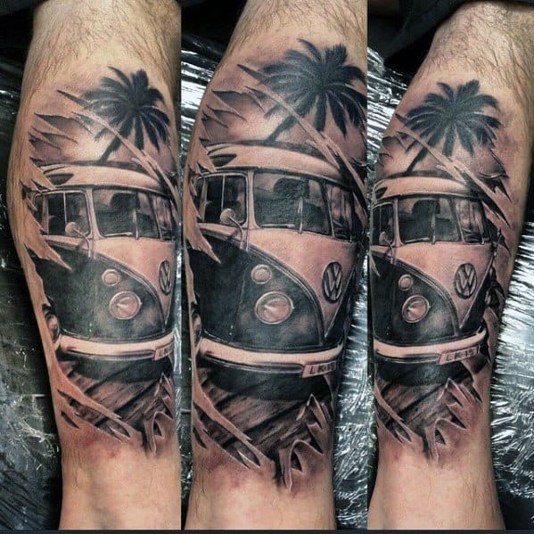 Black and gray tattoo of a Volkswagen van with palm trees and beach elements, wrapped around the leg for a bold travel-inspired design.