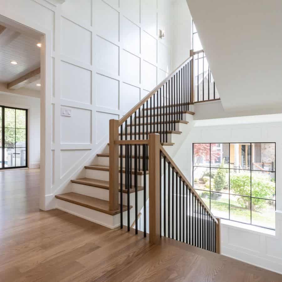 white wainscoting wall covering wood staircase
