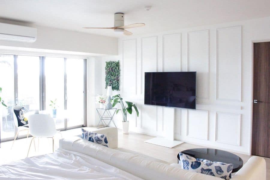white wainscoting wall covering bedroom white sofa