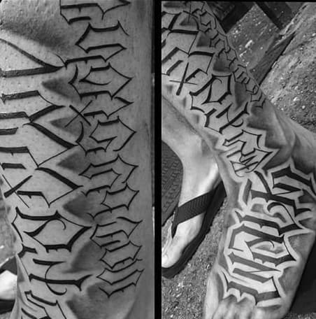 Leg tattoo featuring bold gothic-style lettering with sharp, intricate details, wrapping around the calf and foot for a striking, edgy look.