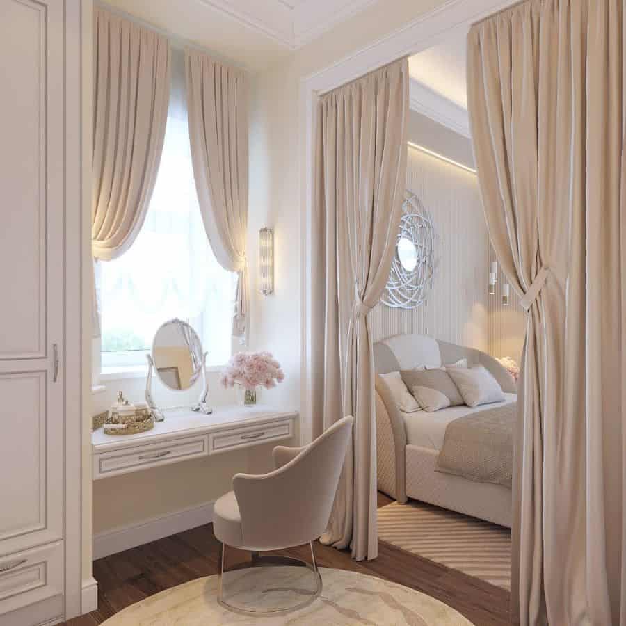Elegant beige bedroom with vanity, mirror, and curtain divider.