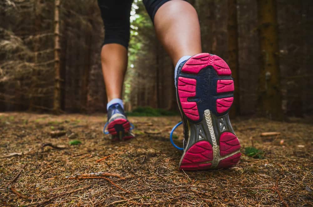 walking shoes on trail with pink bottom