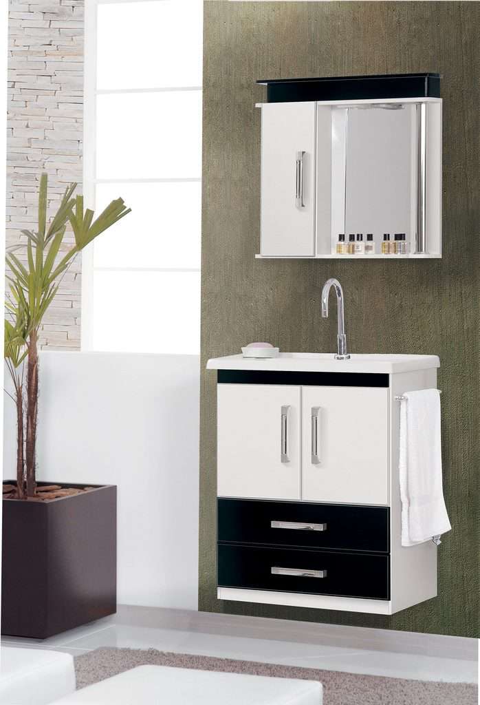 White medicine cabinet and matching vanity with black accents in a modern bathroom.