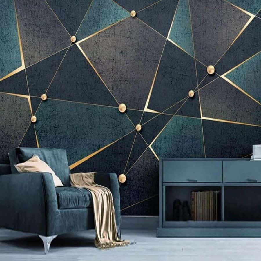 Modern living room with geometric gold-accented wall, teal armchair, and sleek console.