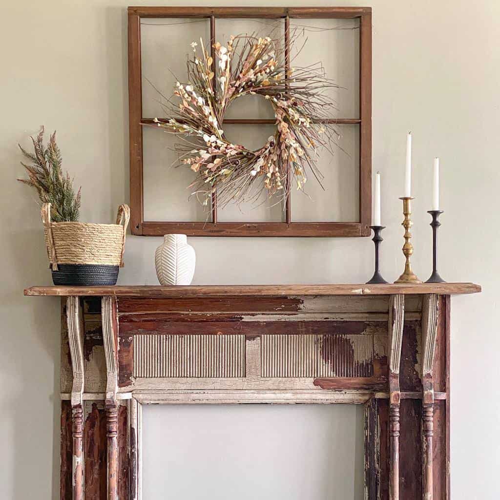 vintage wood fireplace mantle with candles and white vase