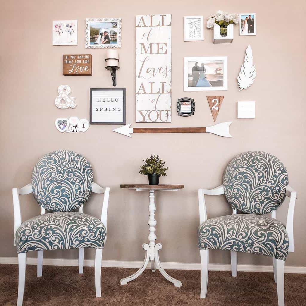 pink wall with framed wedding photos and art