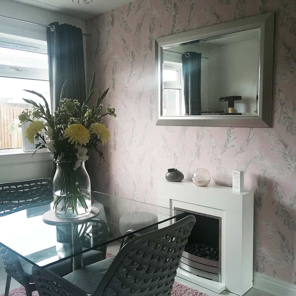 pink floral wallpaper dining room with fireplace