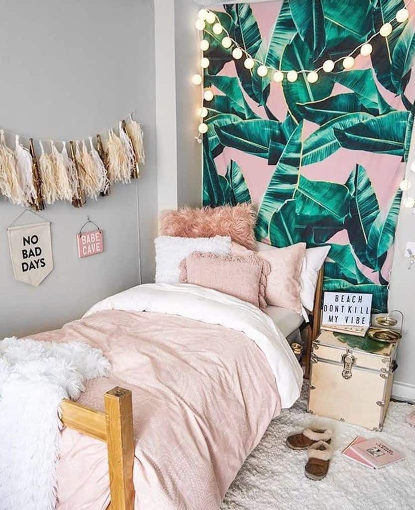 pink and green palm leaf feature wall in girls small bedroom 